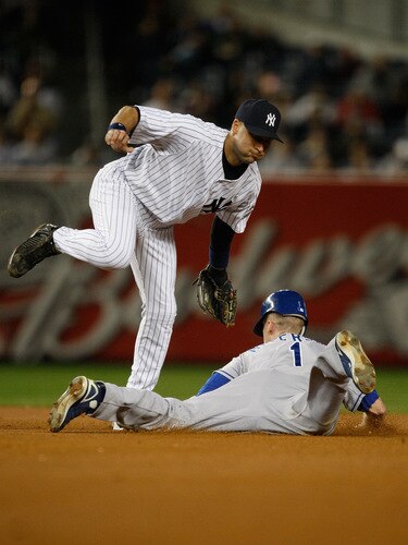 NEW YORK - SEPTEMBER 30:  Josh Anderson #1 of the Kansas City Royals steals second base past Derek Jeter #2 of the New York Yankees during the game on September 30, 2009 at Yankee Stadium in the Bronx borough of New York City.  <br /><br /><span class="help">(Photo by Jared Wickerham/Getty Images)</span>