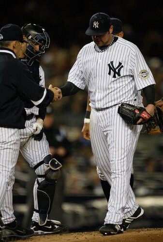 NEW YORK - SEPTEMBER 30:  Joba Chamberlain #62 of the New York Yankees walks off the field after being relieved in the 4th inning during the game on September 30, 2009 at Yankee Stadium in the Bronx borough of New York City.  <br /><br /><span class="help">(Photo by Jared Wickerham/Getty Images)</span>