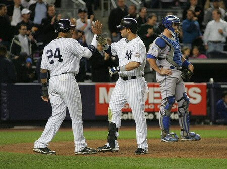 NEW YORK - SEPTEMBER 30: Nick Swisher #33 and Robinson Cano #24 of the New York Yankees celebrate at home plate after Swisher's two run home run against the Kansas City Royals during the game on September 30, 2009 at Yankee Stadium in the Bronx borough of New York City. <br /><br /><span class="help">(Photo by Jared Wickerham/Getty Images)</span>