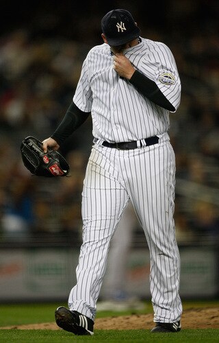 NEW YORK - SEPTEMBER 30: Joba Chamberlain #62 of the New York Yankees walks off the field after being relieved in the 4th inning during the game on September 30, 2009 at Yankee Stadium in the Bronx borough of New York City. <br /><br /><span class="help">(Photo by Jared Wickerham/Getty Images)</span>