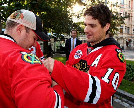 HELSINKI, FINLAND - OCTOBER 01:  Patrick Sharp of Chicago signs autographs for fans during the 2009 Compuware/NHL Premiere Fan Rally at Esplanade Park on October 1, 2009 in Helsinki, Finland. The Compuware/NHL Premiere Helsinki series will be the first regular-season NHL games ever played in Finland. The Blackhawks and Panthers will face off Friday, Oct. 2, and Saturday, Oct. 3, in Helsinki, Finland at Hartwall Areena.  <br /><br /><span class="help">(Photo by Richard Heathcote/Getty Images for the NHL)</span>