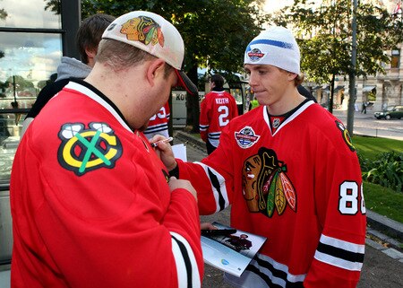HELSINKI, FINLAND - OCTOBER 01:  Patrick Kane of Chicago signs autographs for fans during the 2009 Compuware/NHL Premiere Fan Rally at Esplanade Park on October 1, 2009 in Helsinki, Finland. The Compuware/NHL Premiere Helsinki series will be the first regular-season NHL games ever played in Finland. The Blackhawks and Panthers will face off Friday, Oct. 2, and Saturday, Oct. 3, in Helsinki, Finland at Hartwall Areena.  <br /><br /><span class="help">(Photo by Richard Heathcote/Getty Images for the NHL)</span>