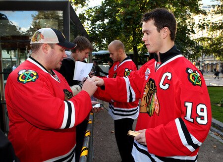 HELSINKI, FINLAND - OCTOBER 01:  Chicago captain Jonathan Toews signs autographs for fans during the 2009 Compuware/NHL Premiere Fan Rally at Esplanade Park on October 1, 2009 in Helsinki, Finland. The Compuware/NHL Premiere Helsinki series will be the first regular-season NHL games ever played in Finland. The Blackhawks and Panthers will face off Friday, Oct. 2, and Saturday, Oct. 3, in Helsinki, Finland at Hartwall Areena.  <br /><br /><span class="help">(Photo by Richard Heathcote/Getty Images for the NHL)</span>