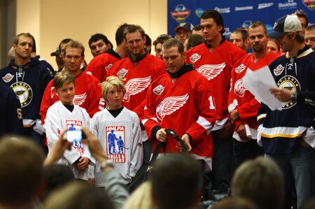 STOCKHOLM, SWEDEN - OCTOBER 01:  Dan Cleary of Detroit Red Wings presents Goal and Dreams equipment to local children during the 2009 Compuware/NHL Premier Fan Rally for Detroit Red Wings and St. Loius Blues at Stockholm Central Station on October 1, 2009 in Stockholm, Sweden.  <br /><br /><span class="help">(Photo by Paul Gilham/NHLI via Getty Images)</span>