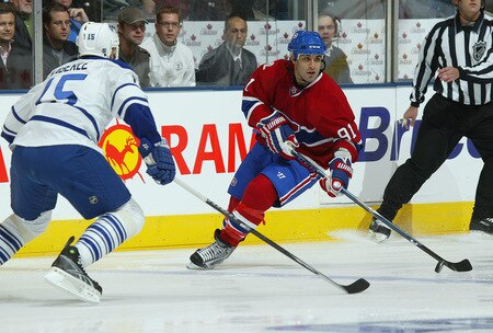 TORONTO - OCTOBER 1:  Scott Gomez #91 of the Montreal Canadiens skates with the puck in a game against the Toronto Maple Leafs in the Maple Leafs home opener October 1, 2009 at the Air Canada Centre in Toronto, Ontario, Canada.  <br /><br /><span class="help">(Photo by Claus Andersen/Getty Images)</span>