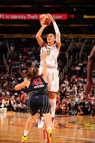 PHOENIX - OCTOBER 1: Diana Taurasi #3 of the Phoenix Mercury puts a shot up over Tully Bevilaqua #41 of the Indiana Fever in Game Two of the WNBA Finals on October 1, 2009 at U.S. Airways Center in Phoenix, Arizona. <br /><br /><span class="help">(Photo by Barry Gossage/NBAE via Getty Images)</span>