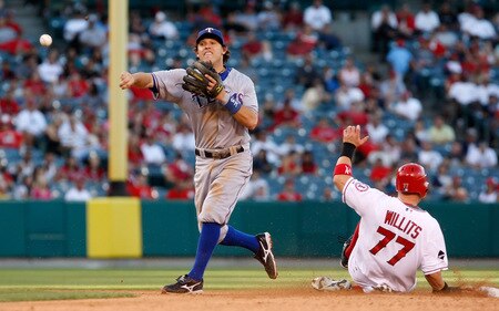 ANAHEIM, CA - OCTOBER 01:  Ian Kinsler #5 of the Texas Rangers forces Reggie Willits #77 of the Los Angeles Angels of Anaheim out at second base before throwing to first to complete the double play in the eighth inning at Angel Stadium on October 1, 2009 in Anaheim, California. The Rangers defeated the Angels 11-3.  <br /><br /><span class="help">(Photo by Jeff Gross/Getty Images)</span>