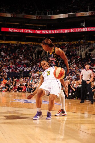 PHOENIX - OCTOBER 1: Temeka Johnson #2 of the Phoenix Mercury is fouled by Tamika Catchings #24 of the Indiana Fever in Game Two of the WNBA Finals on October 1, 2009 at U.S. Airways Center in Phoenix, Arizona. <br /><br /><span class="help">(Photo by Barry Gossage/NBAE via Getty Images)</span>