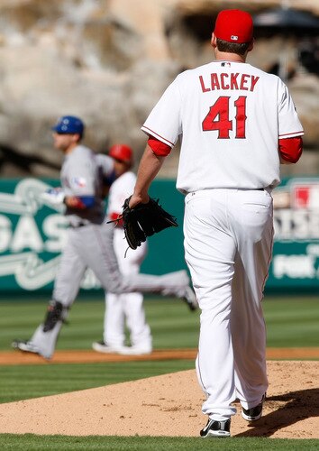 ANAHEIM, CA - OCTOBER 01:  Pitcher John Lackey #41 of the Los Angeles Angels of Anaheim walks back to the mound after giving up a two-run home run to Chris Davis of the Texas Rangers in the second inning at Angel Stadium on October 1, 2009 in Anaheim, California. The Rangers defeated the Angels 11-3.  <br /><br /><span class="help">(Photo by Jeff Gross/Getty Images)</span>
