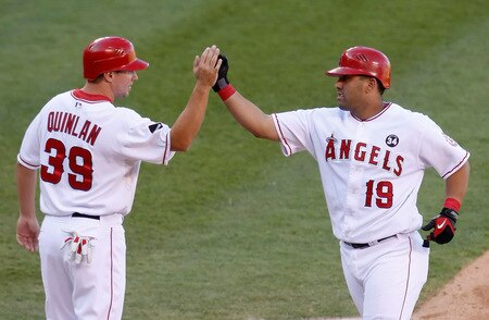 ANAHEIM, CA - OCTOBER 01:  Robb Quinlan #39 of the Los Angeles Angels of Anaheim congratulates Kendry Morales #19 after Morales' two-run home run against the Texas Rangers in the third inning at Angel Stadium on October 1, 2009 in Anaheim, California. The Rangers defeated the Angels 11-3.  <br /><br /><span class="help">(Photo by Jeff Gross/Getty Images)</span>