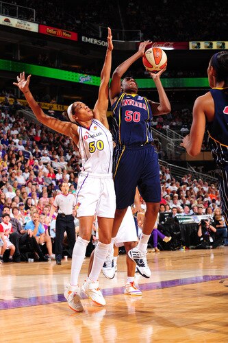 PHOENIX - OCTOBER 1: Jessica Davenport #50 of the Indiana Fever puts a shot up around Tangela Smith #50 of the Phoenix Mercury in Game Two of the WNBA Finals on October 1, 2009 at U.S. Airways Center in Phoenix, Arizona. <br /><br /><span class="help">(Photo by P. A. Molumby/NBAE via Getty Images)</span>