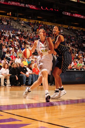 PHOENIX - OCTOBER 1: Nicole Ohlde #30 of the Phoenix Mercury drives against Tamika Catchings #24 of the Indiana Fever in Game Two of the WNBA Finals on October 1, 2009 at U.S. Airways Center in Phoenix, Arizona. <br /><br /><span class="help">(Photo by Barry Gossage/NBAE via Getty Images)</span>