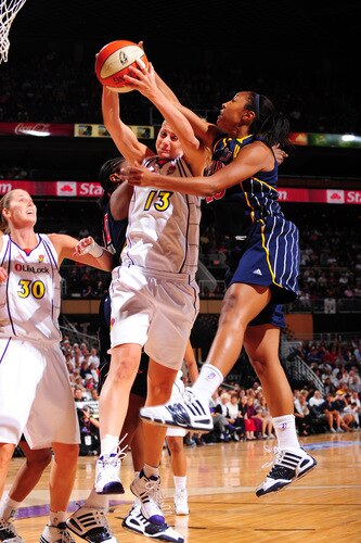 PHOENIX - OCTOBER 1: Penny Taylor #13 of the Phoenix Mercury battles for a ball with Briann January #20 of the Indiana Fever in Game Two of the WNBA Finals on October 1, 2009 at U.S. Airways Center in Phoenix, Arizona. <br /><br /><span class="help">(Photo by P. A. Molumby/NBAE via Getty Images)</span>