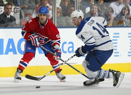TORONTO - OCTOBER 1:  Matt Stajan #14 of the Toronto Maple Leafs skates away from Scott Gomez #91 of  the Montreal Canadiens in the Maple Leafs' home opener October 1, 2009 at the Air Canada Centre in Toronto, Ontario, Canada.  <br /><br /><span class="help">(Photo by Claus Andersen/Getty Images)</span>