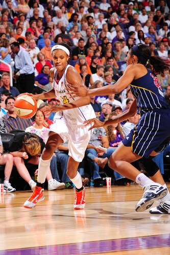 PHOENIX - OCTOBER 1: Dawanna Bonner #24 of the Phoenix Mercury drives against Jessica Moore #31 of the Indiana Fever in Game Two of the WNBA Finals on October 1, 2009 at U.S. Airways Center in Phoenix, Arizona. <br /><br /><span class="help">(Photo by P. A. Molumby/NBAE via Getty Images)</span>