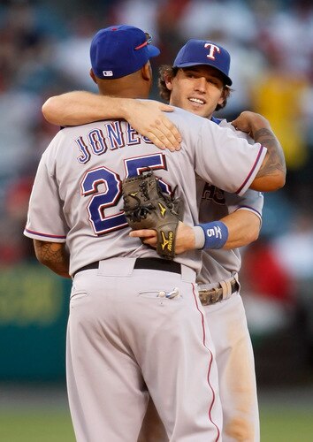 ANAHEIM, CA - OCTOBER 01:  Andruw Jones #25 and Ian Kinsler #5 of the Texas Rangers congratulate one another following their victory over the Los Angeles Angels of Anaheim at Angel Stadium on October 1, 2009 in Anaheim, California. The Rangers defeated the Angels 11-3.  <br /><br /><span class="help">(Photo by Jeff Gross/Getty Images)</span>