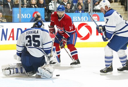 TORONTO - OCTOBER 1:  Tomas Plekanic #14 of the Montreal Canadiens is stopped by Vesa Toskala #35 of the Toronto Maple Leafs in the Maple Leafs' home opener on October 1, 2009 at the Air Canada Centre in Toronto, Ontario. The Canadiens dfeated the Leafs 4-3 in overtime. <br /><br /><span class="help">(Photo by Claus Andersen/Getty Images)</span>