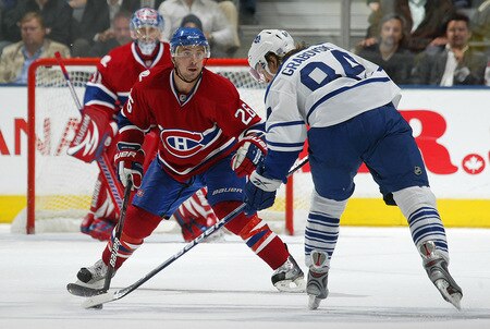 TORONTO - OCTOBER 1:  Josh Gorges #26 of the Montreal Canadiens defends against Mikhail Grabovski #84 of the Toronto Maple Leafs in the Maple Leafs' home opener on October 1, 2009 at the Air Canada Centre in Toronto, Ontario. The Canadiens defeated the Leafs 4-3 in overtime. <br /><br /><span class="help">(Photo by Claus Andersen/Getty Images)</span>