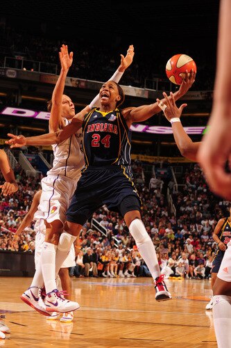 PHOENIX - OCTOBER 1: Tamika Catchings #24 of the Indiana Fever puts a shot up around Diana Taurasi #3 of the Phoenix Mercury in Game Two of the WNBA Finals on October 1, 2009 at U.S. Airways Center in Phoenix, Arizona. <br /><br /><span class="help">(Photo by Barry Gossage/NBAE via Getty Images)</span>
