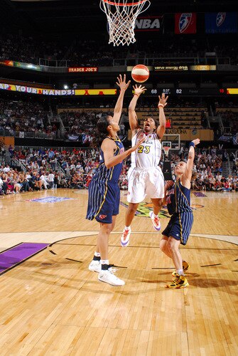 PHOENIX - OCTOBER 1: Cappie Pondexter #23 of the Phoenix Mercury puts a shot up over the block of Tammy Sutton-Brown #8 of the Indiana Fever in Game Two of the WNBA Finals on October 1, 2009 at U.S. Airways Center in Phoenix, Arizona. <br /><br /><span class="help">(Photo by Barry Gossage/NBAE via Getty Images)</span>