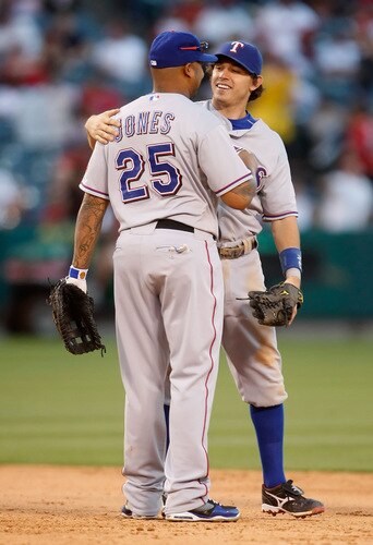 ANAHEIM, CA - OCTOBER 01:  Andruw Jones #25 and Ian Kinsler #5 of the Texas Rangers congratulate one another following their victory over the Los Angeles Angels of Anaheim at Angel Stadium on October 1, 2009 in Anaheim, California. The Rangers defeated the Angels 11-3.  <br /><br /><span class="help">(Photo by Jeff Gross/Getty Images)</span>