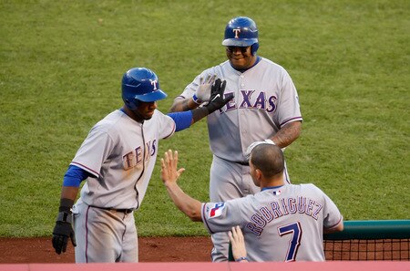 ANAHEIM, CA - OCTOBER 01:  (L-R) Julio Borbon #29 of the Texas Rangers is congratulated by Andruw Jones #25 and Ivan Rodriguez #7 after scoring on a sacrifice fly by Jones in the sixth inning against the Los Angeles Angels of Anaheim at Angel Stadium on October 1, 2009 in Anaheim, California. The Rangers defeated the Angels 11-3.  <br /><br /><span class="help">(Photo by Jeff Gross/Getty Images)</span>