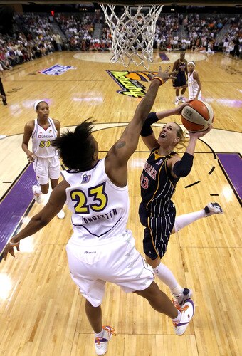 PHOENIX - OCTOBER 01:  Katie Douglas #23 of the Indiana Fever lays up a shot against Cappie Pondexter #23 of the Phoenix Mercury in Game Two of the 2009 WNBA Finals at US Airways Center on October 1, 2009 in Phoenix, Arizona.  The Fever defeated the Mercury 94-83 to tie the series at 1-1.  <br /><br /><span class="help">(Photo by Christian Petersen/Getty Images)</span>