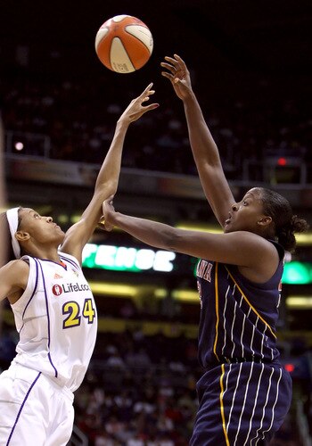 PHOENIX - OCTOBER 01:  Ebony Hoffman #32 of the Indiana Fever puts up a shot over DeWanna Bonner #24 of the Phoenix Mercury in Game Two of the 2009 WNBA Finals at US Airways Center on October 1, 2009 in Phoenix, Arizona.  The Fever defeated the Mercury 94-83 to tie the series at 1-1.  <br /><br /><span class="help">(Photo by Christian Petersen/Getty Images)</span>