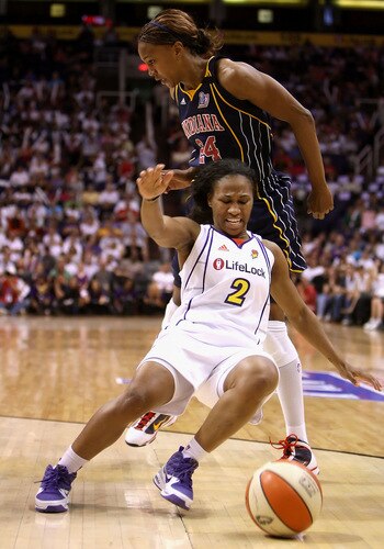 PHOENIX - OCTOBER 01:  Temeka Johnson #2 of the Phoenix Mercury loses control of the ball as she is fouled by Tamika Catchings #24 of the Indiana Fever in Game Two of the 2009 WNBA Finals at US Airways Center on October 1, 2009 in Phoenix, Arizona.  The Fever defeated the Mercury 94-83 to tie the series at 1-1.  <br /><br /><span class="help">(Photo by Christian Petersen/Getty Images)</span>