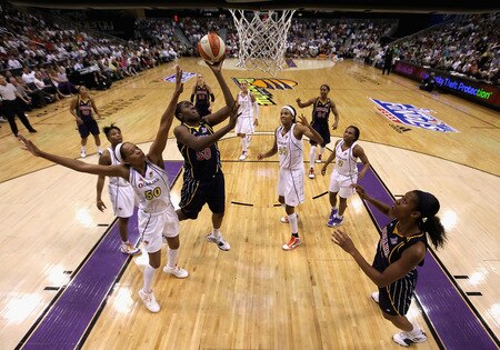 PHOENIX - OCTOBER 01:  Jessica Davenport #50 of the Indiana Fever puts up a shot over Tangela Smith #50 of the Phoenix Mercury in Game Two of the 2009 WNBA Finals at US Airways Center on October 1, 2009 in Phoenix, Arizona. The Fever defeated the Mercury 94-83 to tie the series at 1-1.  <br /><br /><span class="help">(Photo by Christian Petersen/Getty Images)</span>