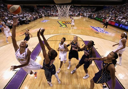 PHOENIX - OCTOBER 01:  DeWanna Bonner #24 of the Phoenix Mercury lays up a shot past Tamika Catchings #24 of the Indiana Fever in Game Two of the 2009 WNBA Finals at US Airways Center on October 1, 2009 in Phoenix, Arizona. The Fever defeated the Mercury 94-83 to tie the series at 1-1.  <br /><br /><span class="help">(Photo by Christian Petersen/Getty Images)</span>