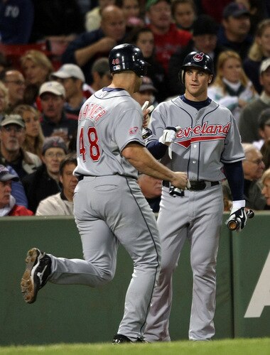 BOSTON - OCTOBER 02:  Trevor Crowe #26 of the Cleveland Indians congratulates teammate Travis Hafner #48 after Hafner scored a run in the fifth inning against the Boston Red Sox on October 2, 2009 at Fenway Park in Boston, Massachusetts.  <br /><br /><span class="help">(Photo by Elsa/Getty Images)</span>