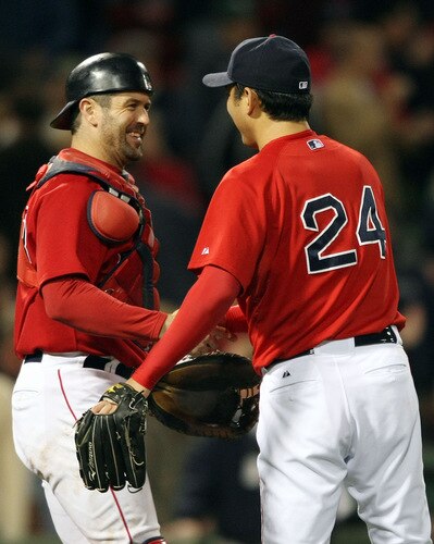 BOSTON - OCTOBER 02:  Jason Varitek #33 and Takashi Saito #24 of the Boston Red Sox celebrate the win over the Cleveland Indians on October 2, 2009 at Fenway Park in Boston, Massachusetts. The Red Sox defeated the Indians 6-2.  <br /><br /><span class="help">(Photo by Elsa/Getty Images)</span>