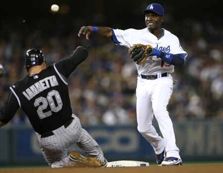 LOS ANGELES - OCTOBER 3:  Second baseman Orlando Hudson #13 of the Los Angeles Dodgers throws to first to turn a double play after forcing out Chris Iannetta #20 of the Colorado Rockies on October 3, 2009 at Dodger Stadium in Los Angeles, California.   <br /><br /><span class="help">(Photo by Stephen Dunn/Getty Images)</span>