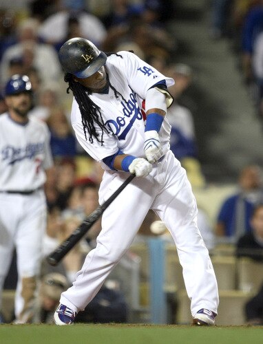 LOS ANGELES - OCTOBER 3: Manny Ramirez #99 of the Los Angeles Dodgers hits an RBI single in the seventh inning against the Colorado Rockies on October 3, 2009 at Dodger Stadium in Los Angeles, California. <br /><br /><span class="help">(Photo by Stephen Dunn/Getty Images)</span>