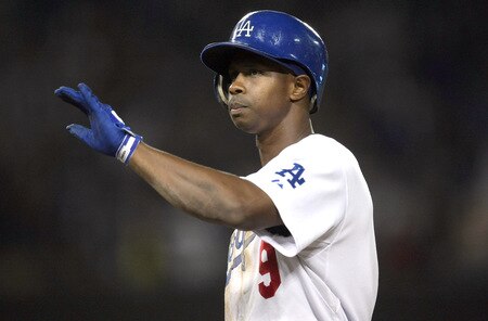 LOS ANGELES, CA - OCTOBER 03: Juan Pierre #9 of the Los Angeles Dodgers celebrates at first base after his n RBI single in the seventh inning against the Colorado Rockies on October 3, 2009 at Dodger Stadium in Los Angeles, California. <br /><br /><span class="help">(Photo by Stephen Dunn/Getty Images)</span>
