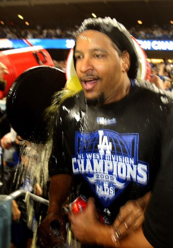 LOS ANGELES, CA - OCTOBER 03:  Manny Ramirez #99 of the Los Angeles Dodgers is doused with Gatorade by teammates as they celebrate after the game with the Colorado Rockies on October 3, 2009 at Dodger Stadium in Los Angeles, California.  The Dodgers won 5-0 to clinch the National League West.  <br /><br /><span class="help">(Photo by Stephen Dunn/Getty Images)</span>