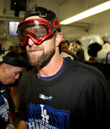 LOS ANGELES - OCTOBER 3:  Casey Blake #23 of the Los Angeles Dodgers  wears a mask as they celebrate after the game with the Colorado Rockies on October 3, 2009 at Dodger Stadium in Los Angeles, California.  The Dodgers won 5-0 to clinch the National League West.  <br /><br /><span class="help">(Photo by Stephen Dunn/Getty Images)</span>