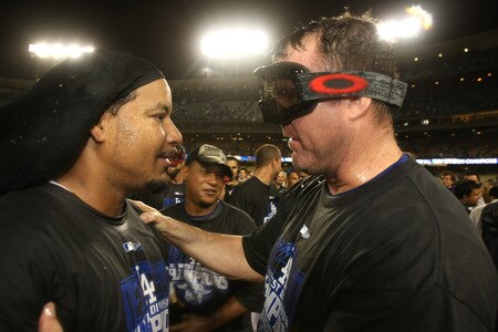 LOS ANGELES, CA - OCTOBER 03:  Manny Ramirez #99 and Jim Thome #25 of the Los Angeles Dodgers greet as they celebrate after the game with the Colorado Rockies on October 3, 2009 at Dodger Stadium in Los Angeles, California.  The Dodgers won 5-0 to clinch the National League West.  <br /><br /><span class="help">(Photo by Stephen Dunn/Getty Images)</span>