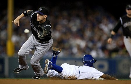 LOS ANGELES, CA - OCTOBER 03:  Shortstop Clint Barmes #12 of the Colorado Rockies takes the throw as Juan Pierre #9 of the Los Angeles Dodgers slides into second with a stolen base on October 3, 2009 at Dodger Stadium in Los Angeles, California.  <br /><br /><span class="help">(Photo by Stephen Dunn/Getty Images)</span>
