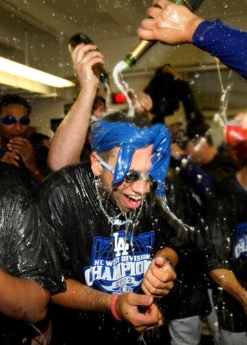 LOS ANGELES, CA - OCTOBER 03:  James Loney #7 (R)  of the Los Angeles Dodgers is doused with champagne as they celebrate after the game with the Colorado Rockies on October 3, 2009 at Dodger Stadium in Los Angeles, California.  The Dodgers won 5-0 to clinch the National League West.  <br /><br /><span class="help">(Photo by Stephen Dunn/Getty Images)</span>