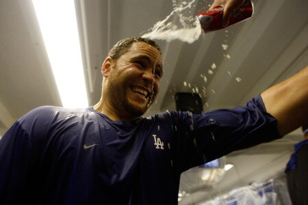 LOS ANGELES, CA - OCTOBER 03:  Russell Martin #55 of the Los Angeles Dodgers gets beer poured on his face as celebration after winning the National League West against the Colorado Rockies on October 3, 2009 in Los Angeles, California.  <br /><br /><span class="help">(Photo by Jacob de Golish/Getty Images)</span>
