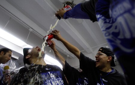 LOS ANGELES, CA - OCTOBER 03: Russell Martin #55 of the Los Angeles Dodgers gets beer poured on his face as celebration after winning the National League West against the Colorado Rockies on October 3, 2009 in Los Angeles, California.  <br /><br /><span class="help">(Photo by Jacob de Golish/Getty Images)</span>