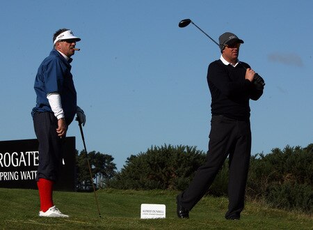 CARNOUSTIE, SCOTLAND - OCTOBER 04:  Shane Warne of Australia watched by Sir Ian Botham of England on the tee at the 15th hole during the third round of the Alfred Dunhill Links Championship at Carnoustie Golf Links on October 4, 2009 in Carnoustie, Scotland. The third round was postponed on saturday due to gale force winds.  <br /><br /><span class="help">(Photo by David Cannon/Getty Images)</span>