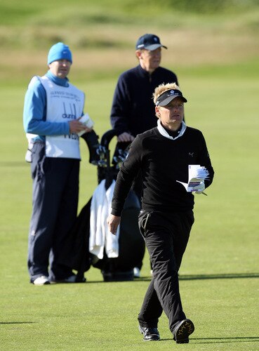 CARNOUSTIE, SCOTLAND - OCTOBER 04:  Soren Kjeldsen of Denmark prepares to play his second shot at the 15th hole shadowed by his amateur partner Gerard Tvedt during the third round of the Alfred Dunhill Links Championship at Carnoustie Golf Links on October 4, 2009 in Carnoustie, Scotland. The third round was postponed on saturday due to gale force winds.  <br /><br /><span class="help">(Photo by David Cannon/Getty Images)</span>