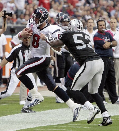 HOUSTON - OCTOBER 04:  Quarterback Matt Schaub #8 of the Houston Texans is pushed out of bounds by linebacker  Thomas Howard #53 of the Oakland Raiders at Reliant Stadium on October 4, 2009 in Houston, Texas.  <br /><br /><span class="help">(Photo by Bob Levey/Getty Images)</span>