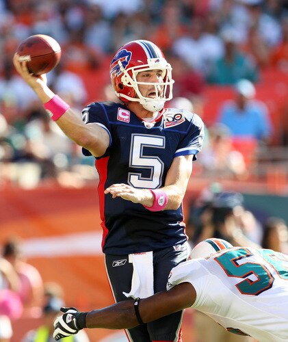 MIAMI - OCTOBER 04:  Quarterback Trent Edwards #5 of the Buffalo Bills gets rid of the ball before being hit by linebacker Charlie Anderson #56 of the Miami Dolphins at Land Shark Stadium on October 4, 2009 in Miami, Florida.  <br /><br /><span class="help">(Photo by Doug Benc/Getty Images)</span>
