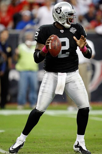 HOUSTON - OCTOBER 04:  Quarterback JaMarcus Russell #2 of the Oakland Raiders drops back to pass against the Houston Texans at Reliant Stadium on October 4, 2009 in Houston, Texas.  <br /><br /><span class="help">(Photo by Ronald Martinez/Getty Images)</span>