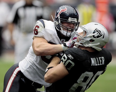 HOUSTON - OCTOBER 04:  Linebacker Brian Cushing #56 of the Houston Texans delivers a hard hit to tight-end Zach Miller #80 of the Oakland Raiders at Reliant Stadium on October 4, 2009 in Houston, Texas.  <br /><br /><span class="help">(Photo by Bob Levey/Getty Images)</span>