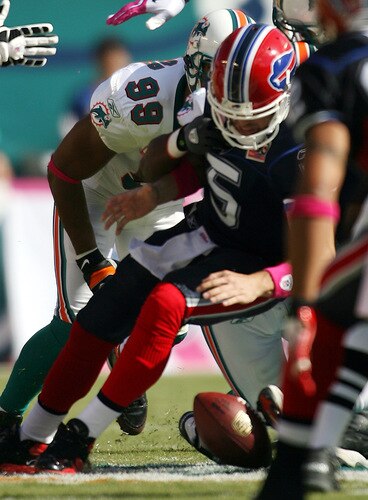 MIAMI - OCTOBER 04:  Defensive end Jason Taylor #99 of the Miami Dolphins sacks Quarterback Trent Edwards #5 the Buffalo Bills causing a fumble at Land Shark Stadium on October 4, 2009 in Miami, Florida.  <br /><br /><span class="help">(Photo by Marc Serota/Getty Images)</span>